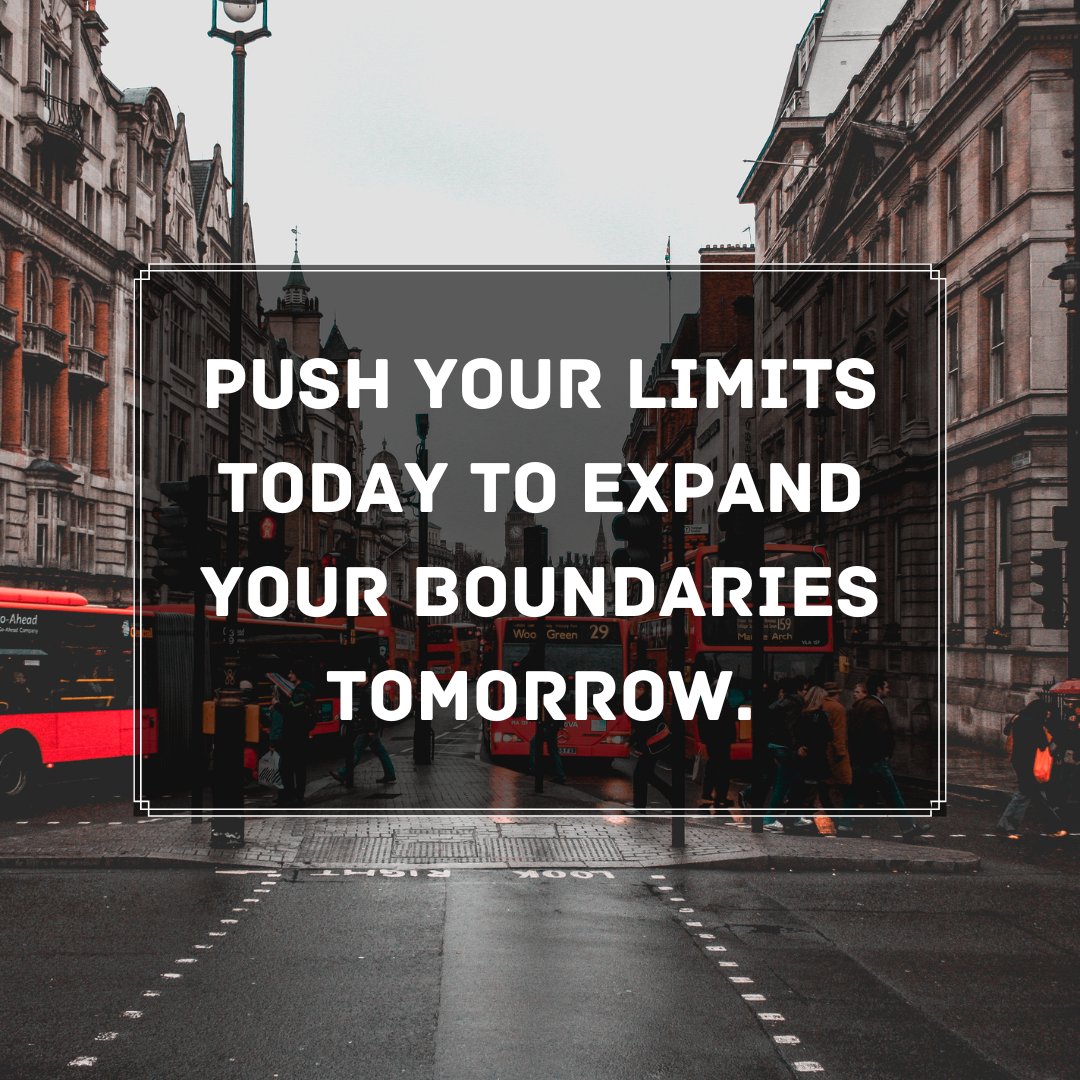 A bustling city street scene with a motivational quote 'Push your limits today to expand your boundaries tomorrow' prominently displayed. Red buses and pedestrians add life to the urban setting, emphasizing the message of growth and pushing boundaries.